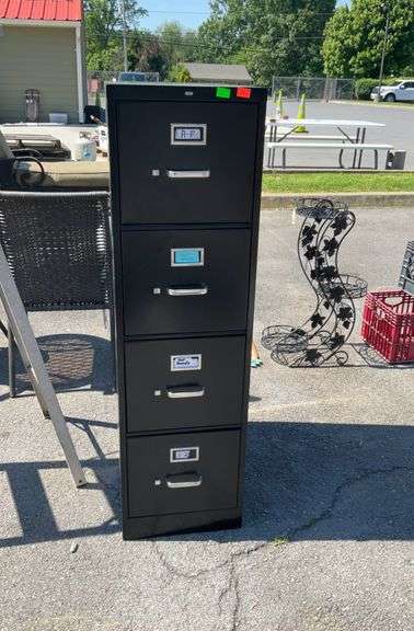 Four drawer metal filing cabinet