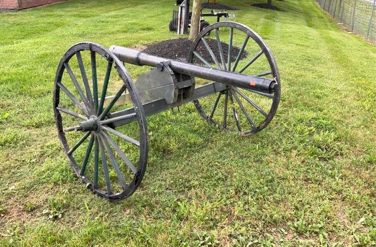 Cannon, decorative,barrel  is 64”L on wooden frame with wooden wheels 42”dia, wheels do have some damage, A great way to warn intruders of impending doom