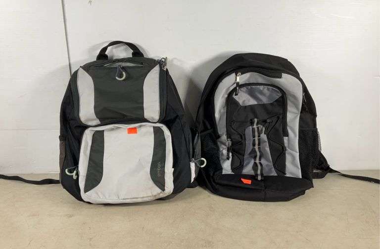 Two backpacks, one Embark made of recycled bottles, has stain and