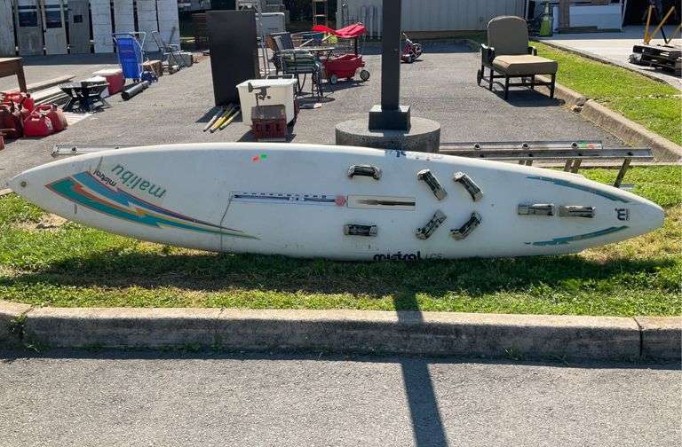 Windsurf sailboard, 11’L, straps are fading and some torn parts, board itself does have some damage
