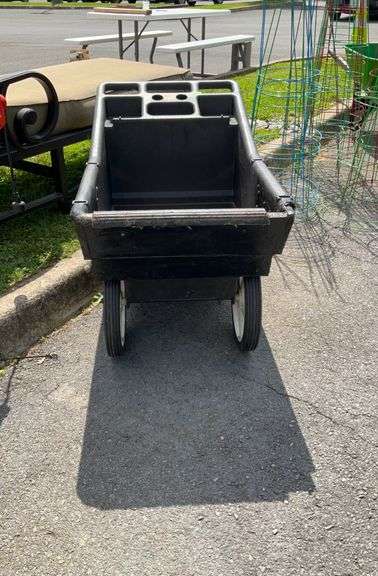 Garden dump cart, poly body, front has been repaired, small holes at bottom