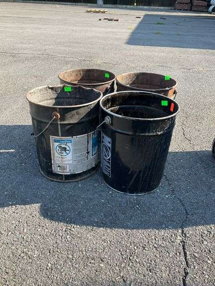 Four metal buckets