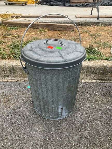 Galvanized lidded trashcan