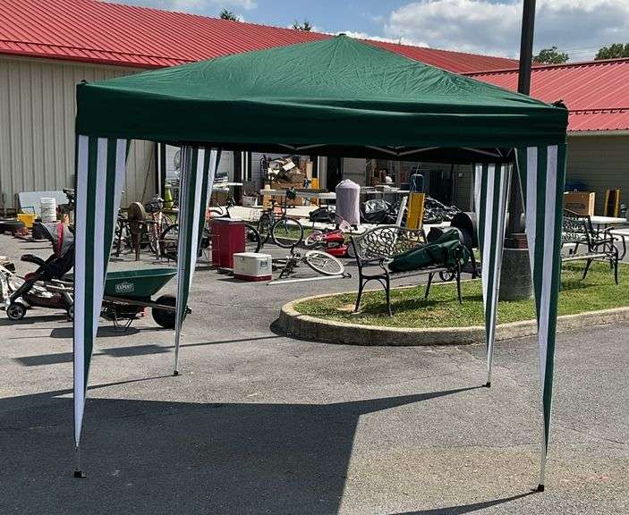 Pop up canopy, 7’8”x 7’8”, with stripped leg hiders, with soft cover carrying case, no holes