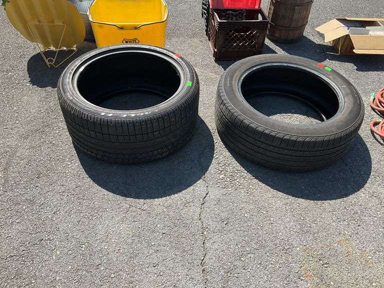Two tires, P285/35ZR19, and  235/55R19