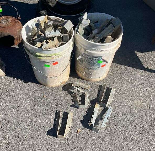 Two Plastic Buckets Containing Simpson Strong-Tie Metal Connectors