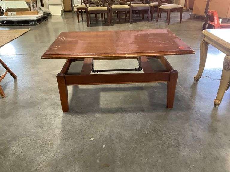 Butler’s Riser Coffee Table with Hinged Lift-Top Design - Hash Auctions