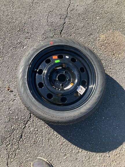 215/50R17 Tire Mounted on Black Multi-Hole Steel Rim