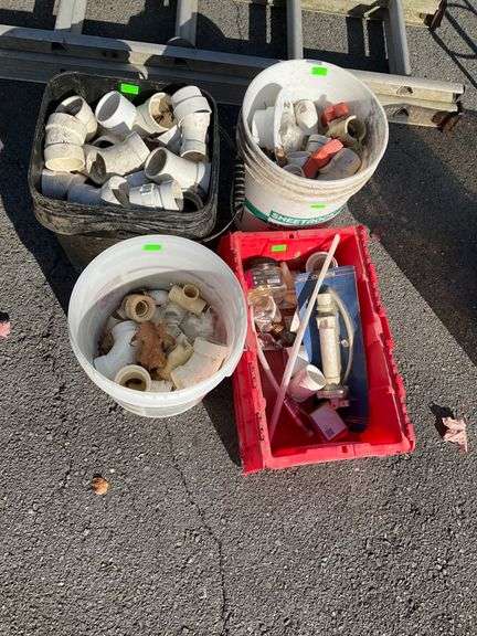 Plumbing Components in Three Plastic Buckets and One Tote