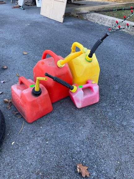 4 Assorted 1-5 Gallon Fuel Cans in Red, Yellow, and Pink