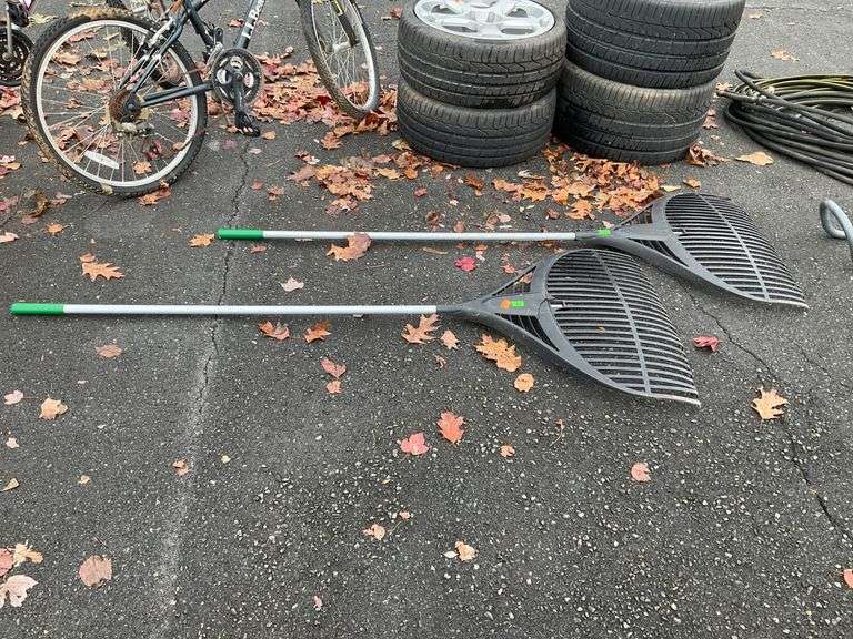 Two Plastic Head Leaf Rakes, One Damaged and One Missing a Tine