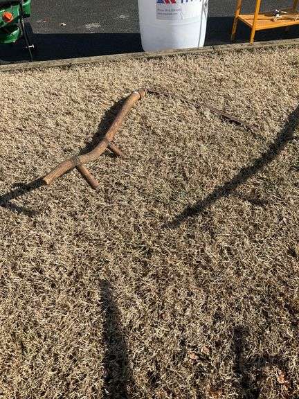 Rustic Scythe with Wooden Handle and Metal Blade