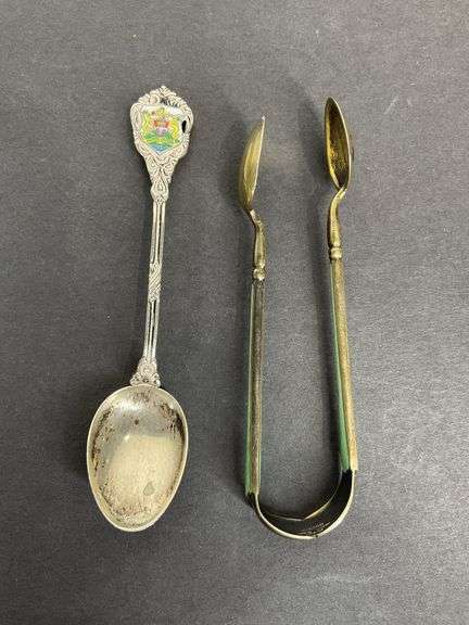 Sterling silver sugar tongs made in Norway and a sterling silver souvenir spoon Hong Kong 25.8grams