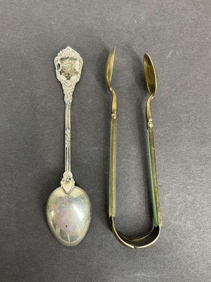 Sterling silver sugar tongs made in Norway and a sterling silver souvenir spoon Hong Kong 25.8grams