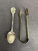 Sterling silver sugar tongs made in Norway and a sterling silver souvenir spoon Hong Kong 25.8grams