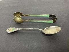 Sterling silver sugar tongs made in Norway and a sterling silver souvenir spoon Hong Kong 25.8grams