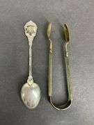 Sterling silver sugar tongs made in Norway and a sterling silver souvenir spoon Hong Kong 25.8grams