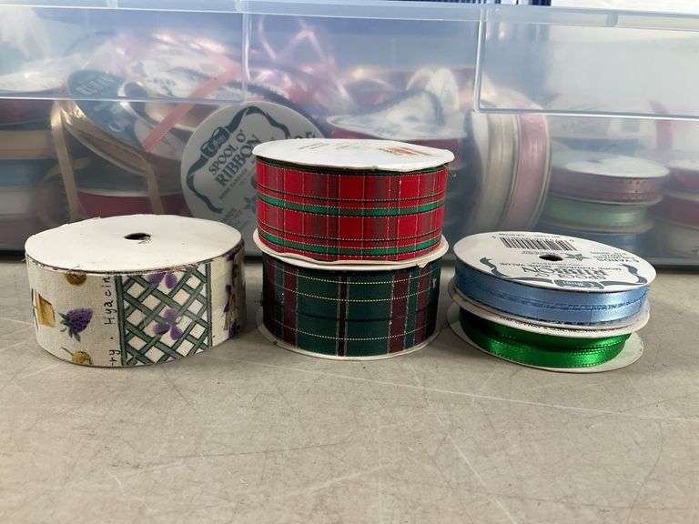 Plastic Storage Bin Containing Assorted Ribbon Spools