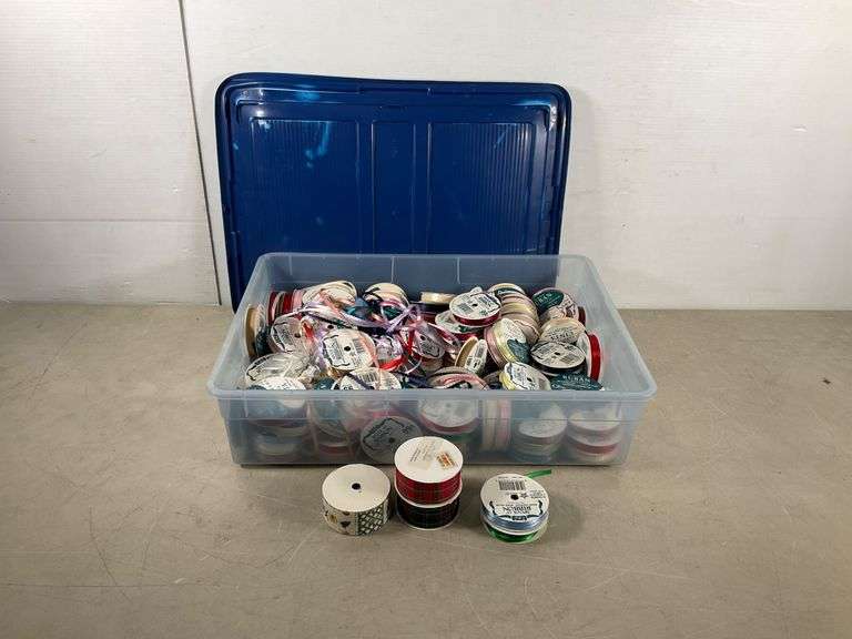 Plastic Storage Bin Containing Assorted Ribbon Spools