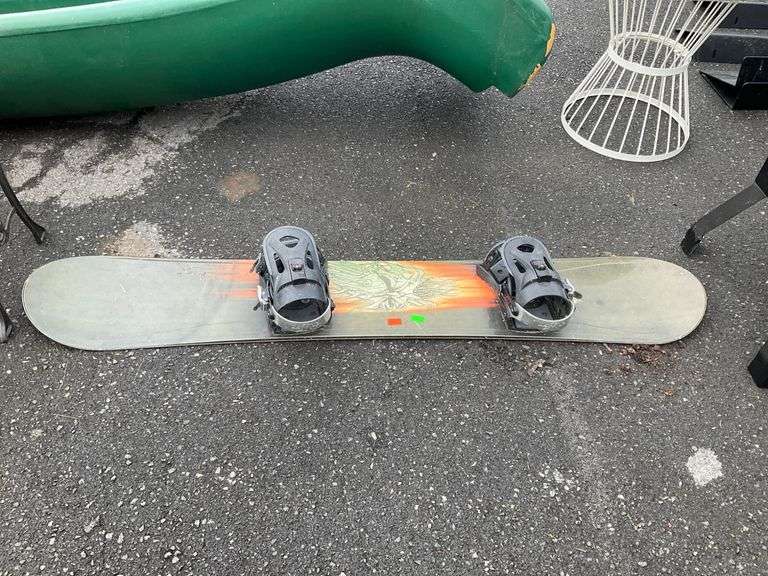 Snowboard with Graphic Design and Attached Bindings