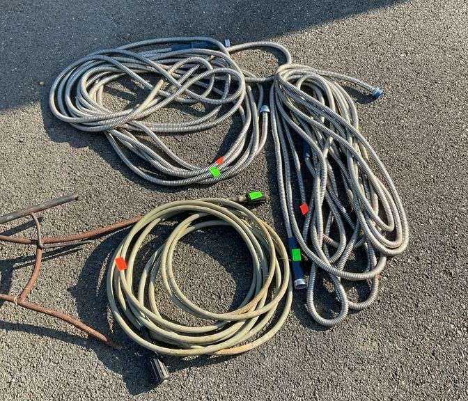 Three Hoses, two flex style water hoses and one for pressure washer.