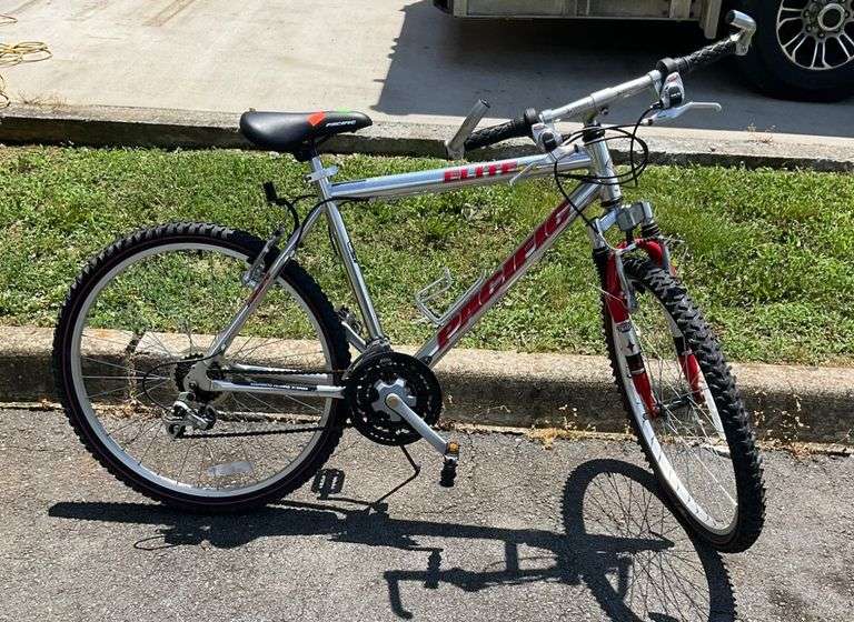 Silver and Red Huffy Mountain Bike with Front Suspension