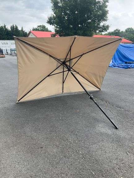 Beige Patio Umbrella Missing Top, 9’L x 6’W