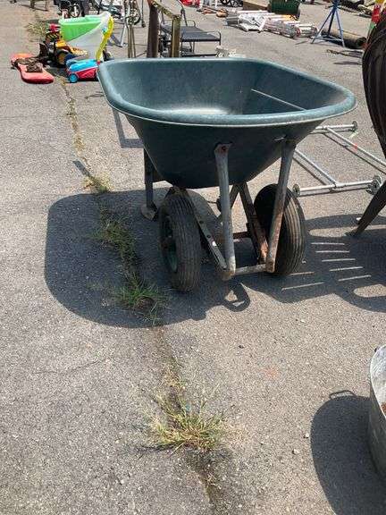 Green Polyethylene Wheelbarrow With Metal Frame and Dual Wheels