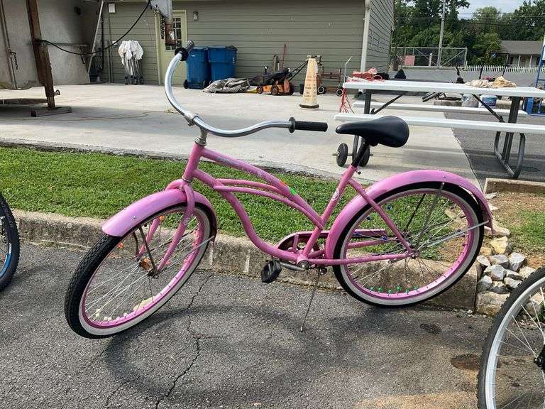 Pink Cruiser Bike With Balloon Tires and Curved Handlebars