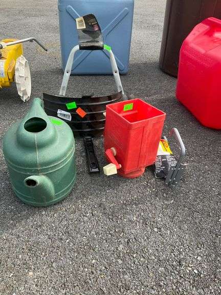 Mounted Garden Hose Holder, Manual Seeder, Plastic Watering Can, and Garden Power Tool Hanger
