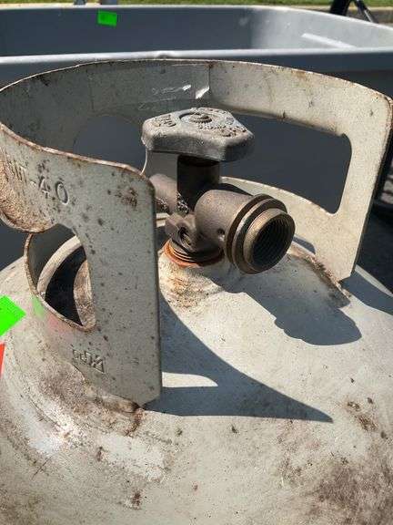 Propane Tank with very little Fuel and Plastic Tote
