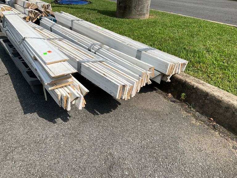 Bundles of White Trim Molding on Pallet