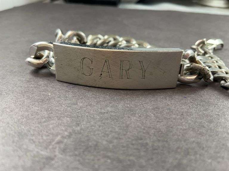 Two Men's Bracelet One Is Engraved With "Gary"