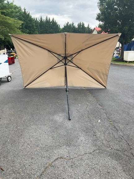 Beige Patio Umbrella Missing Top, 9’L x 6’W