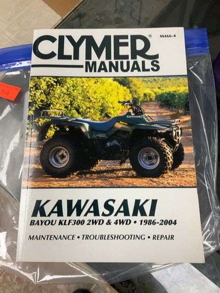 Kawasaki Bayou 300 4-Wheeler, 4x4. Front 4 foot blade and winch.
