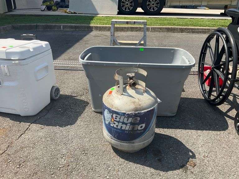 Propane Tank with very little Fuel and Plastic Tote