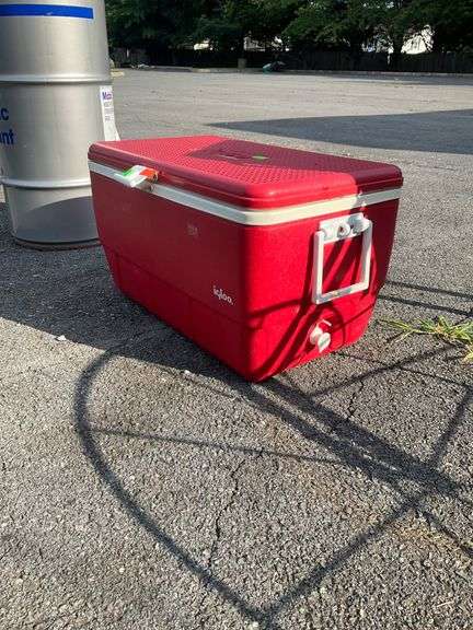 Red Igloo Cooler with Hinged Lid and Side Handles