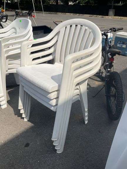 Four Stackable Plastic Patio Chairs
