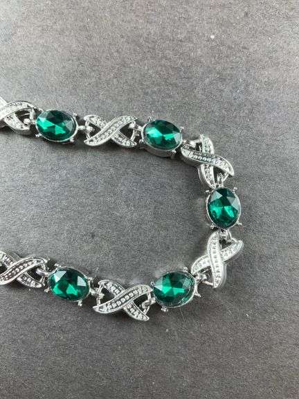 Green CZ silvertone X&O bracelet 7-8in