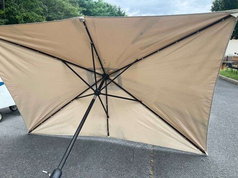 Beige Patio Umbrella Missing Top, 9’L x 6’W
