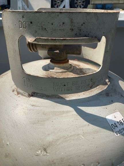 Propane Tank with very little Fuel and Plastic Tote