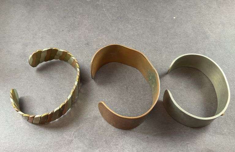 Three Cuff Bracelets One of Copper, One Copper And Silvertone, One Heavy Silver Tone