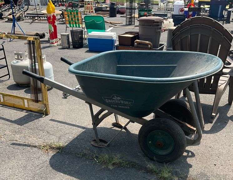 Green Polyethylene Wheelbarrow With Metal Frame and Dual Wheels