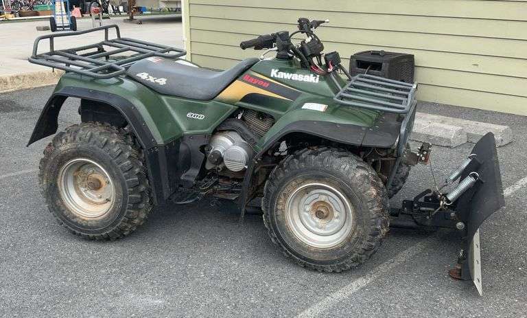 Kawasaki Bayou 300 4-Wheeler, 4x4. Front 4 foot blade and winch.
