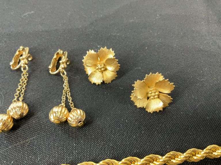 Monet goldtone chain 20in, pair of clip on earrings, and floral pins