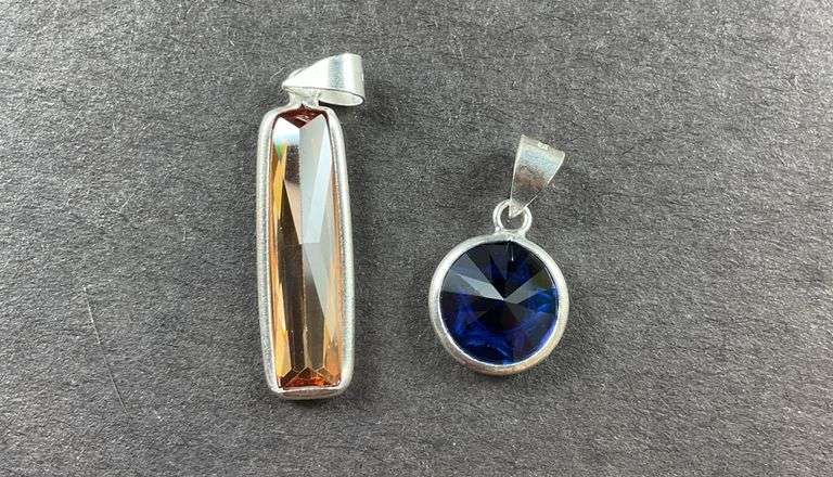 Two sterling silver pendants