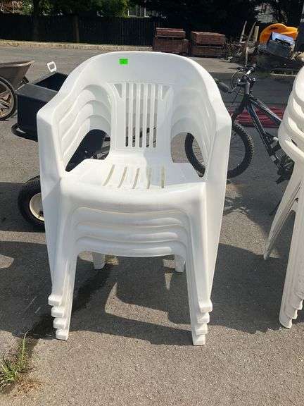 Four Stackable Plastic Patio Chairs