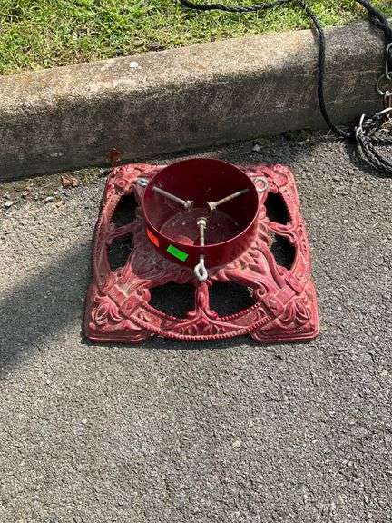 Red Cast Iron Christmas Tree Stand with Decorative Openwork Design