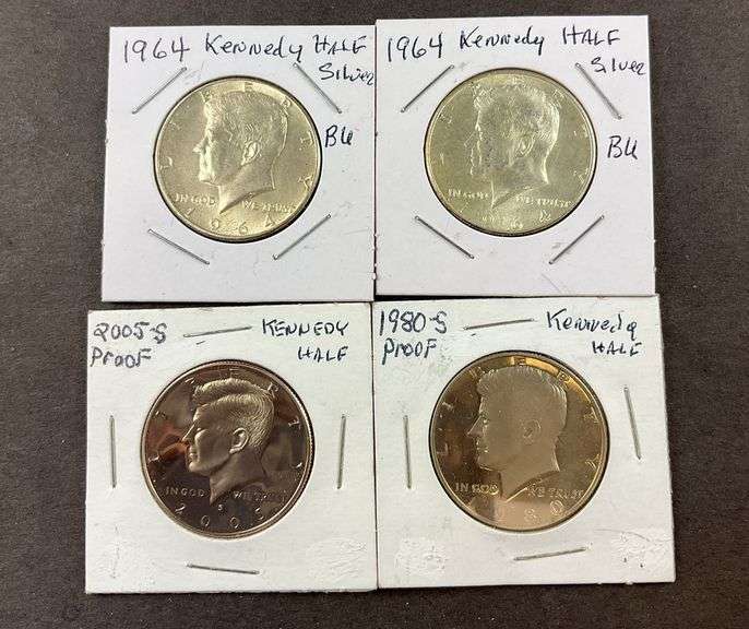 Four Kennedy half dollars 1964(2), 2005, and 1980