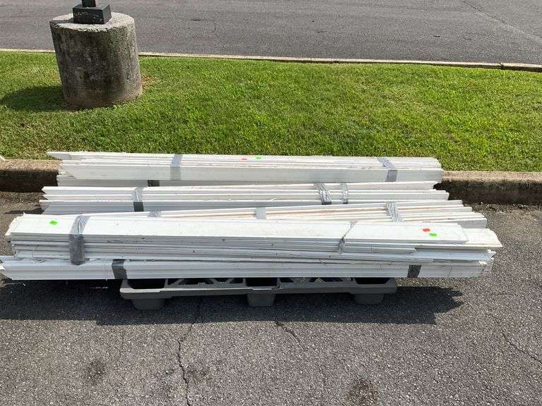 Bundles of White Trim Molding on Pallet